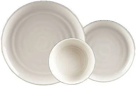 Top-down view of three cream stoneware bowls/mugs